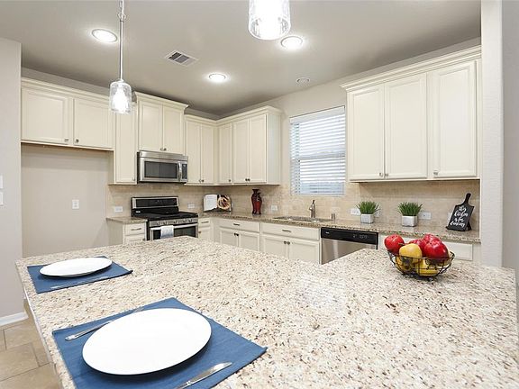 Kitchen boasts 42" cabinets and huge granite island.
