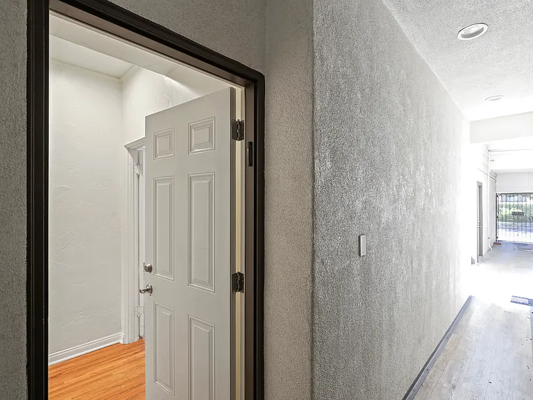 Building spans entire length from Canfield Ave to Doheny with front entrance on Canfield and back entrance on Doheny. This is hallway from back entrance.