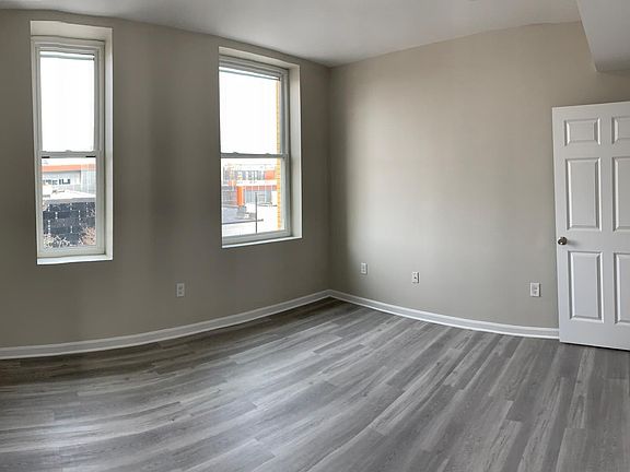 One of 2 bedrooms with City view