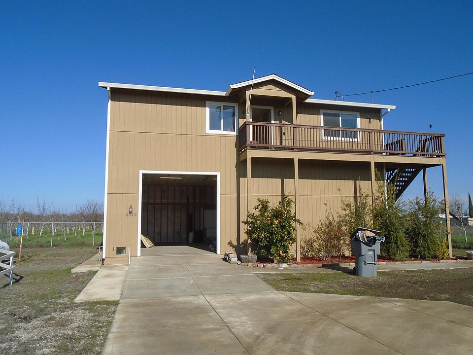 Front of 2 story with 1200 sf upstairs with 3 br, 2 ba, 1200 storage and office downstairs with door opener