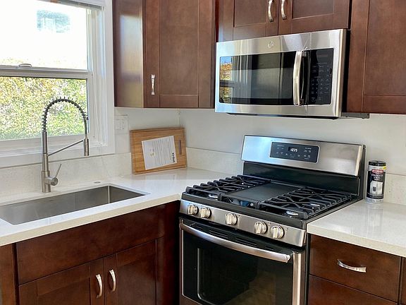 New sink, professional faucet, countertops and lighting