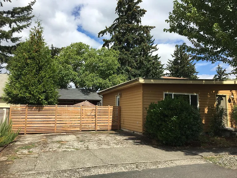 fenced in private side yard and driveway
