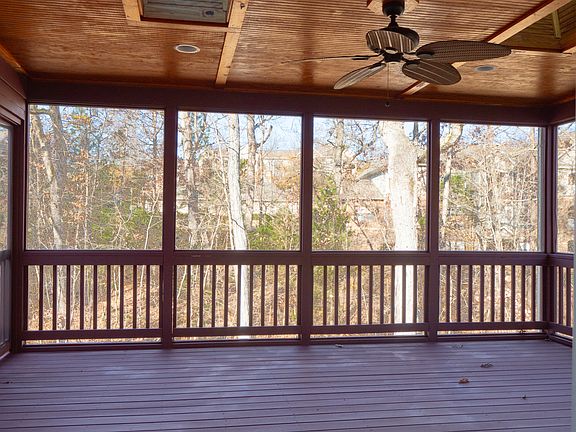 Freshly painted indoor screen porch with great view of the trees