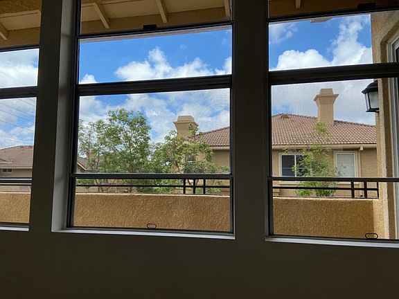 View of Patio and Neighborhood from Living Room Windows