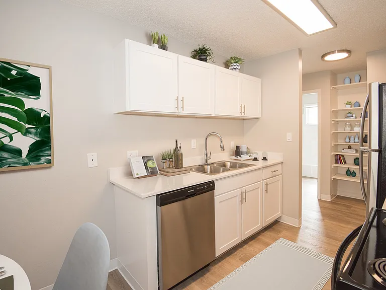 Kitchen with stainless steel appliances and built in shelves