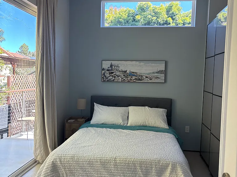 Second bedroom with 8' long sliding door and 126" long closet