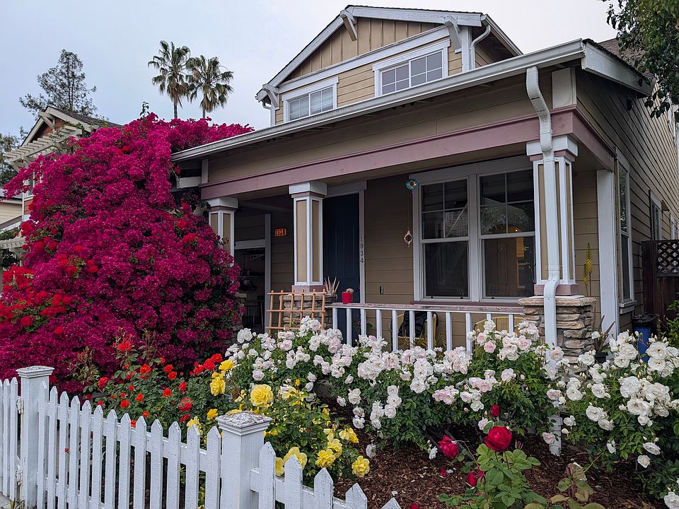 Front patio with bright roses and bougainvillea