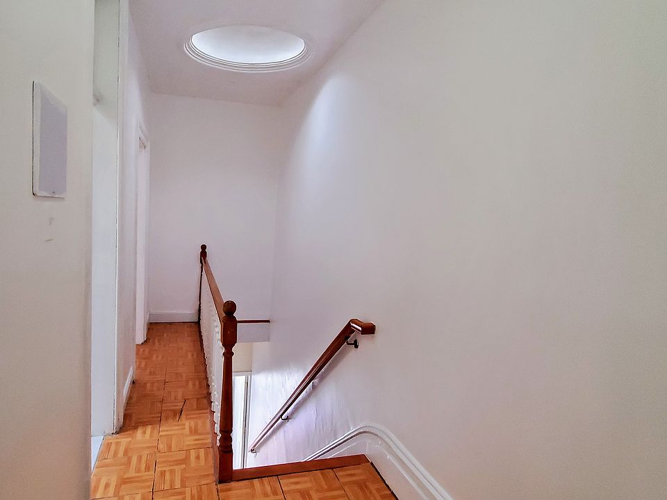 Entrance view from the kitchenette during the daytime with the stairwell skylight