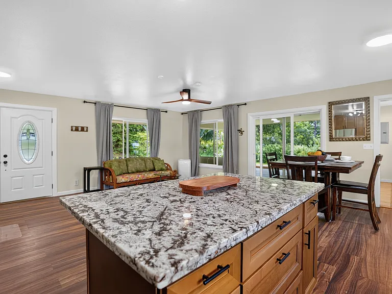 Open concept kitchen with ample cabinet space and prep area on island
