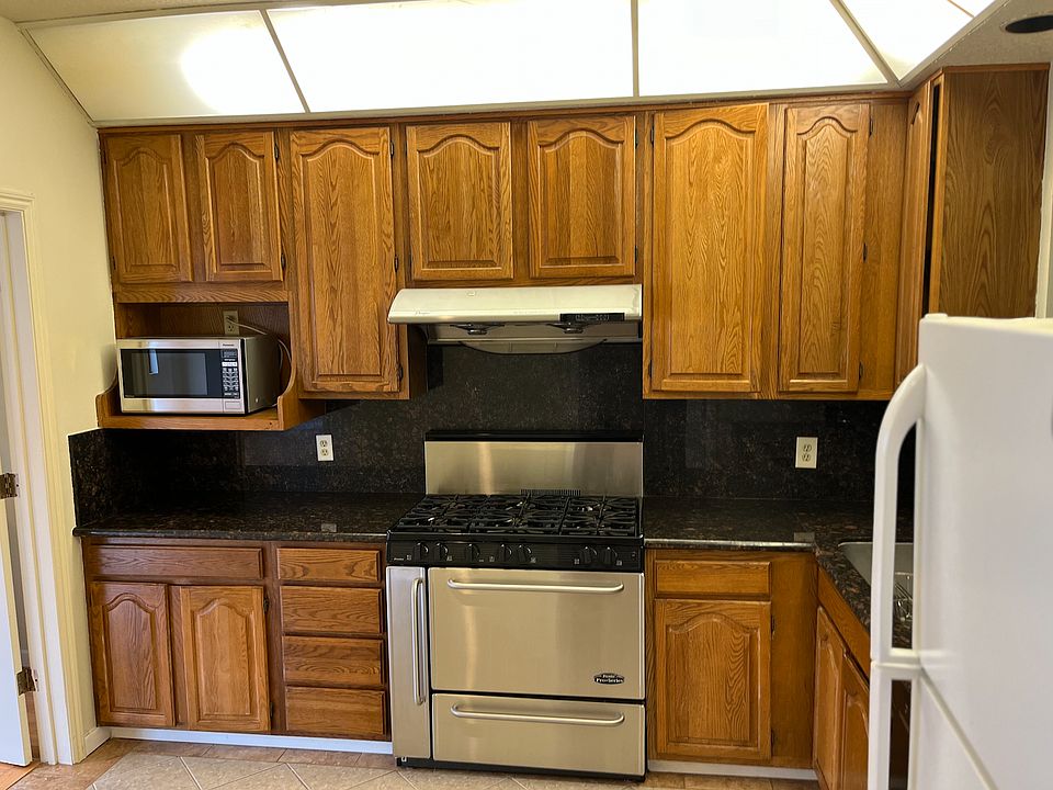 Granite countertop and wide stove/oven.