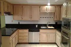 Gourmet cooktop to the right and oven/micro on the left