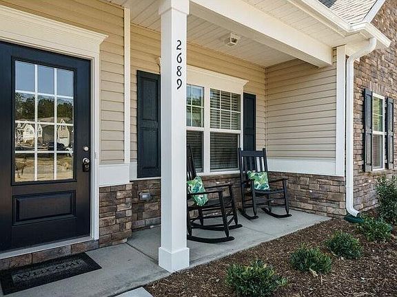 Beautiful front porch for enjoying those summer evening with friends and family