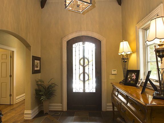 Vaulted and beamed entry with slate floors