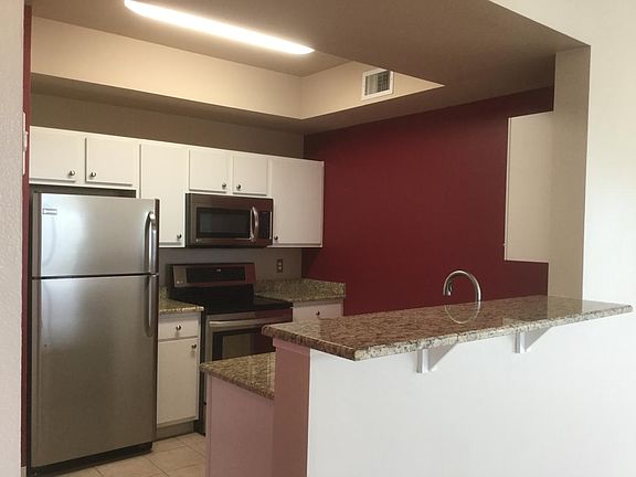 Kitchen has new stainless steel refrigerator and dishwasher