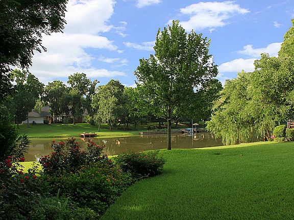 The home, on a 0.54 acre waterfront lot, has STUNNING VIEWS of Oxbow Lake.