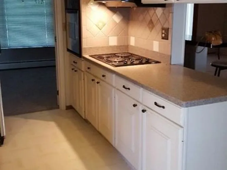 Left, entery into dining room, kitchen oven and cooking area.