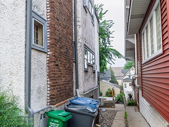 Receptacles, rain barrel, and side door for rear unit entry