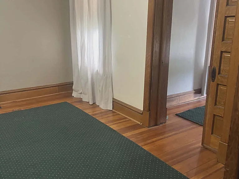 First Floor Master Bedroom, Pocket Door and view to Front Parlor