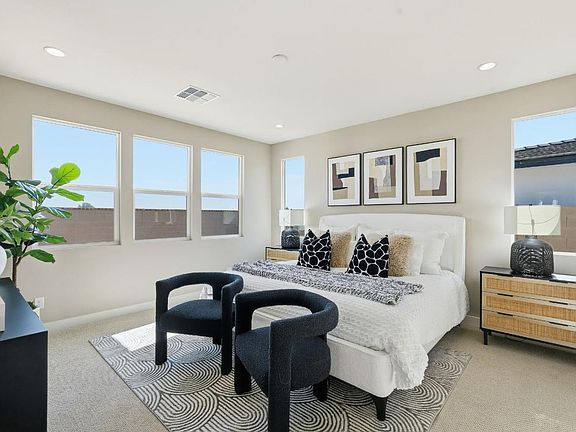 Expansive primary bedroom with luxurious finishes