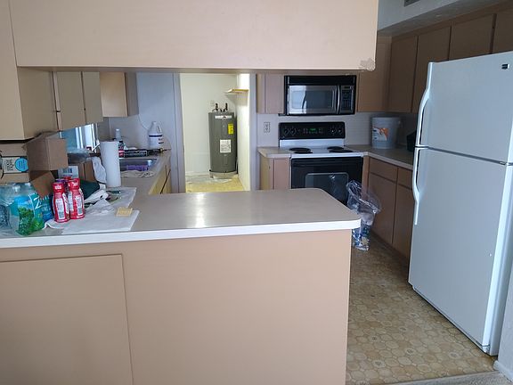 Kitchen looking into laundry