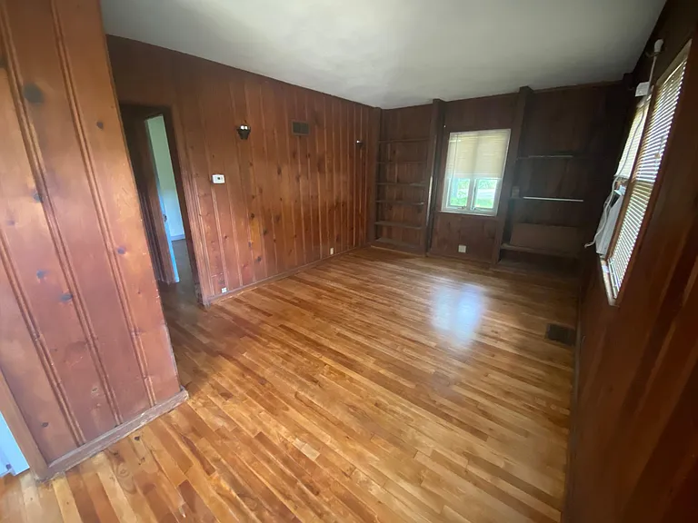 Large living room with newly finished wood floors