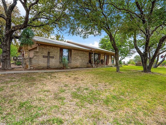 Farmhouse sits on top of a hill