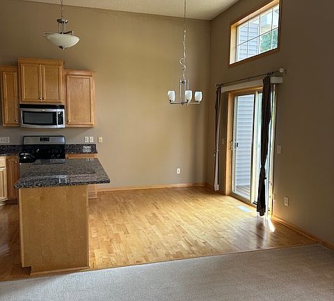 Hardwood flooring in dinette and new deck outside kitchen.