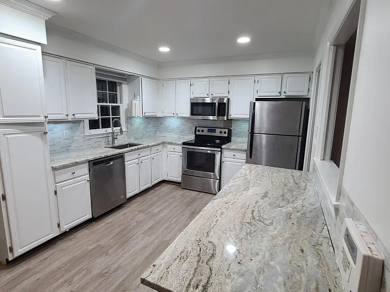 Extra counter space on additional cabinets with new granite.