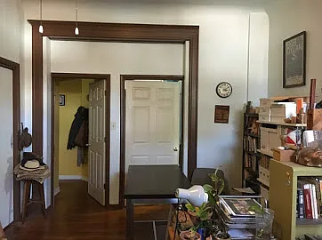 Living room leading to two bedrooms
