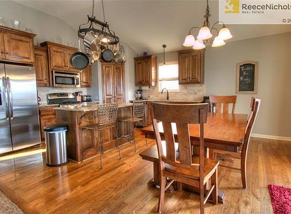 Stainless steel appliances, wood floors and large walk-in pantry