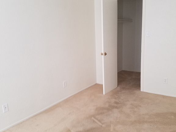 Bedroom with walk-in closet