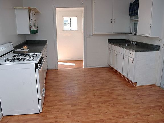 Unit C wood floor kitchen