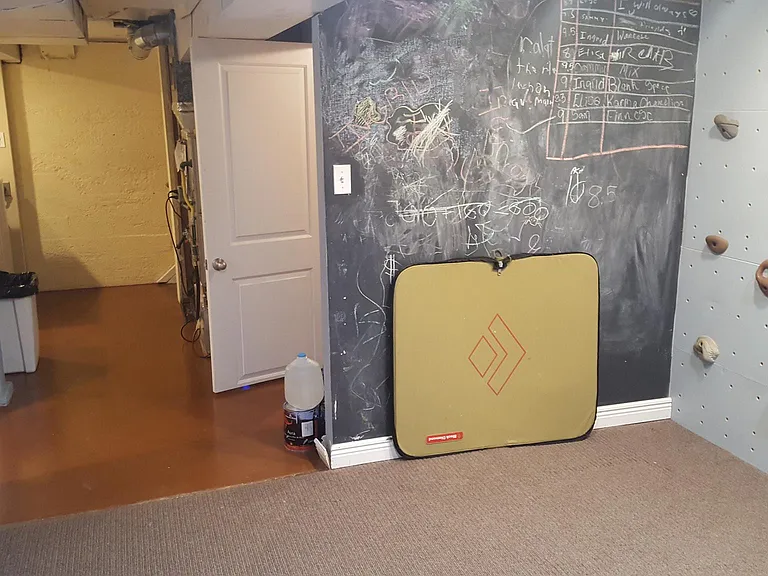 Basement playroom leading to laundry room