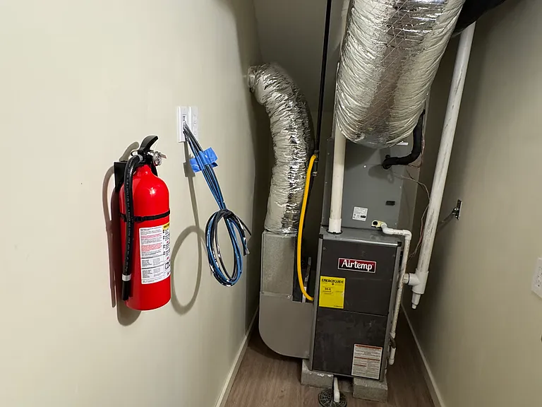 Furnace room, forced air heat and AC with programable thermostat. Spectrum ready ethernet and coax lines for hardwired connections or wifi in every room
