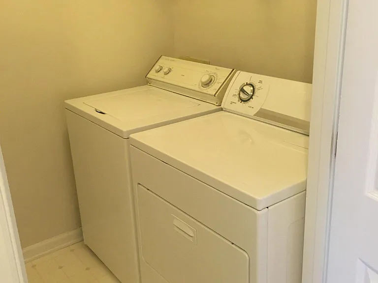 laundry room with washer and dryer included