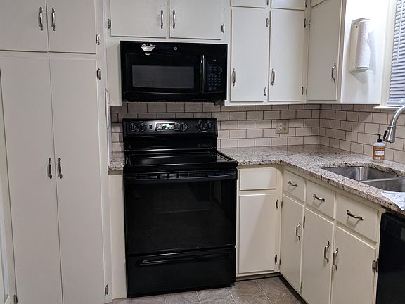 Kitchen has new granite and tile backsplash. Stove, microwave, dishwasher(new), refrigerator included.
