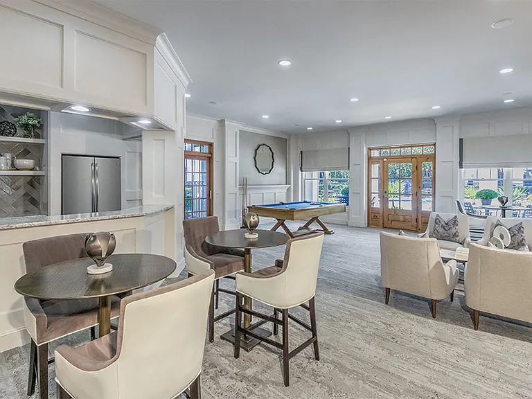 Clubhouse features billiards room with seating and TV