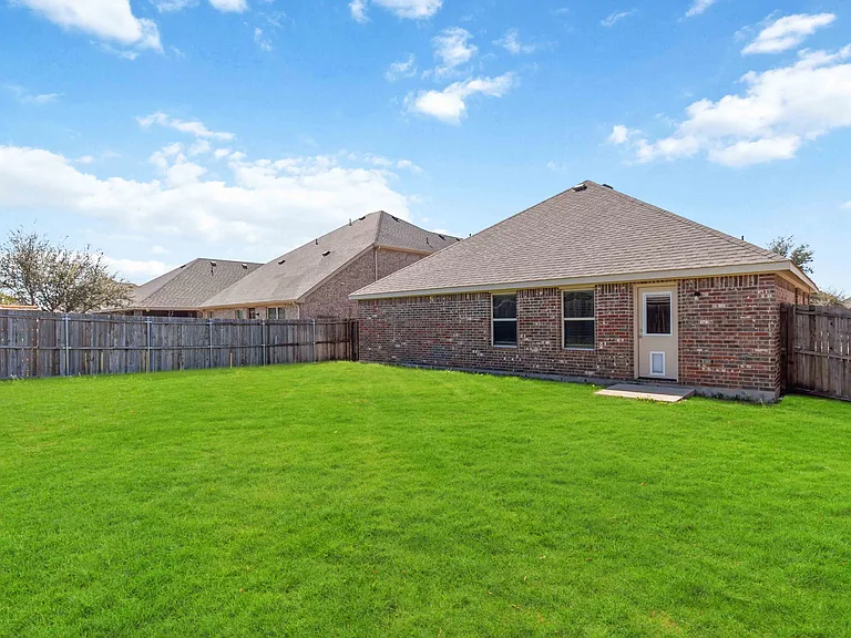 Large fully fenced backyard.