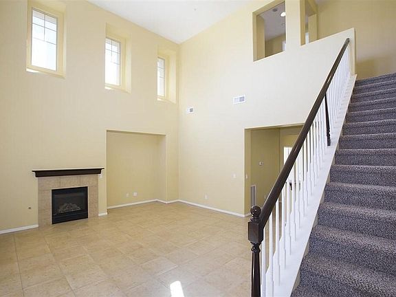 Living room & stairs leading to master suite
