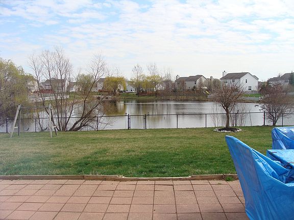 Fully fenced yard backs up to pond.