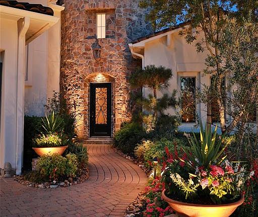 FOLLOW THE COBBLESTONE BRICK ROAD TO THIS HEAVENLY HOME - No stone unturned as you will notice walking up the sidewalk to the iron front door. Exhibiting a palette of refined finished and appointments, the awe-inspiring home presents a unique entranc