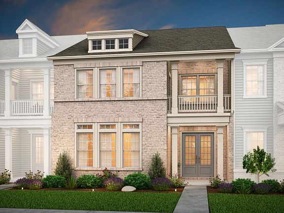 Fairmont Exterior 4 features brick, covered porch and deck, and 2 car rear garage