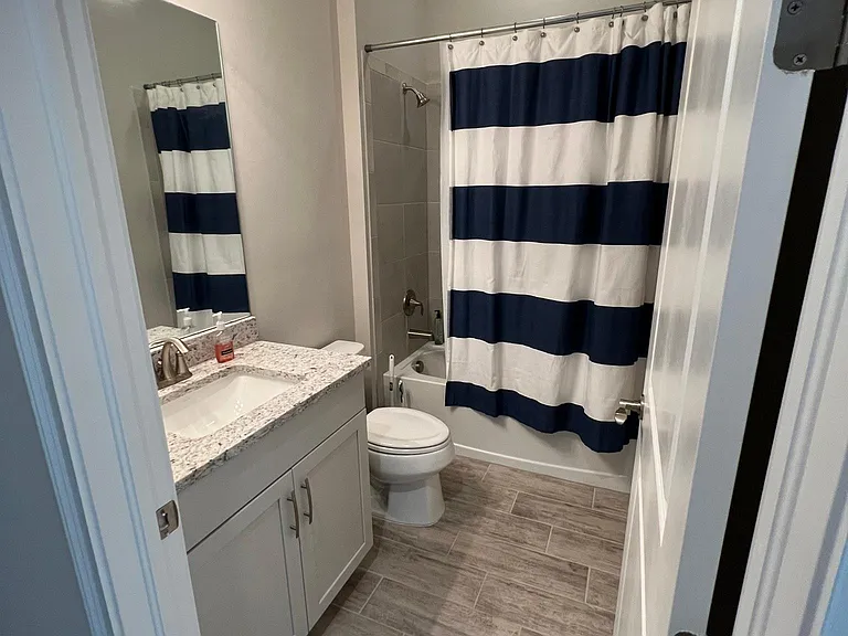 3rd full bath, located between 3rd and 4th bedrooms