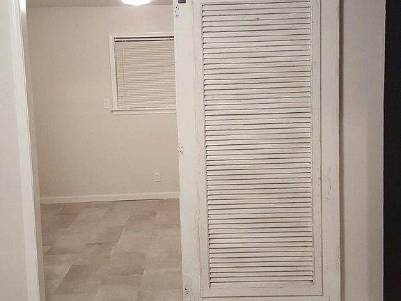 View from kitchen into large laundry/utility rooom