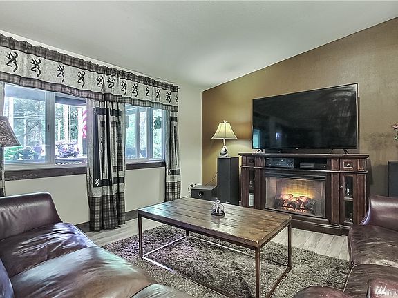 Living room with electric fireplace. 