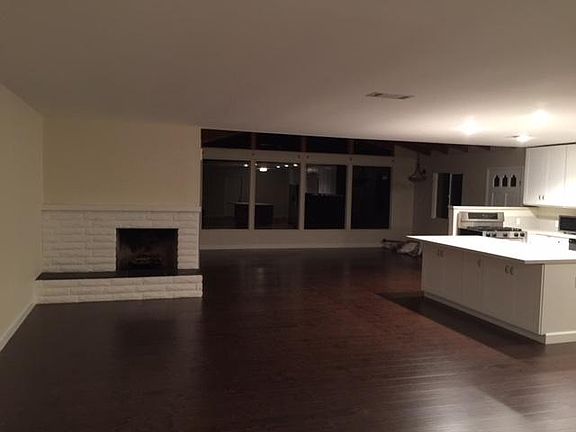 Enter into the expansive great room and kitchen