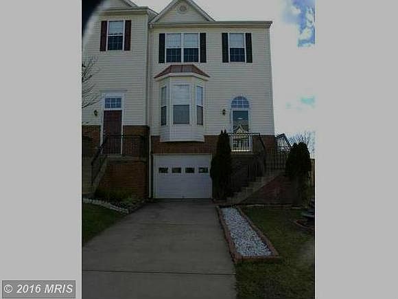 End unit 1 car garage townhouse with amper visitor parking in front of the house.