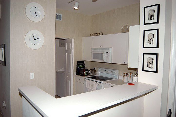 Kitchen with laundry room behind