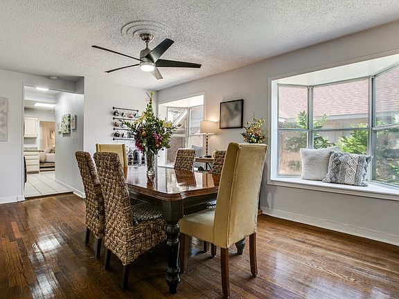 Second den or large dining with big bay windows! Right off the kitchen. Used for years as a study or craft room by TCU students