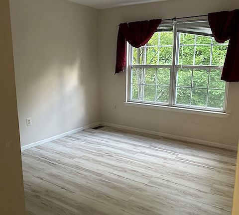 Second Bedroom from door view cabinet style closet to the left